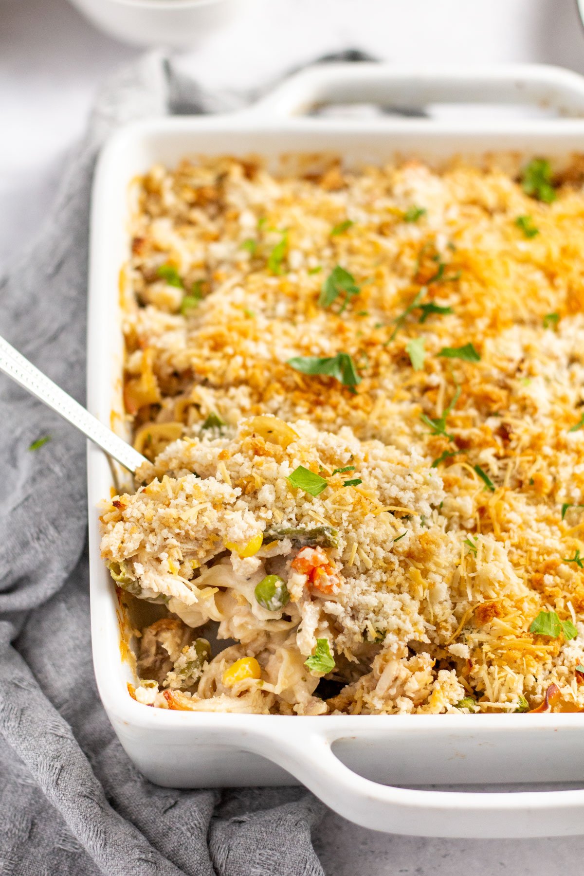 This chicken noodle casserole is a comforting and easy recipe for a weeknight dinner the whole family will love. It has all of the cozy chicken soup flavors, but cooked together with the vegetables in a creamy sauce! It's a great way to use up leftover chicken or a rotisserie chicken, and reheats well so it makes tasty leftovers! #chickennoodle #casserole #chickencasserole #pastabake #leftoverchicken