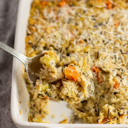 This chicken and wild rice casserole recipe is a hearty, easy recipe for a weeknight dinner or to use up leftover chicken or even leftover turkey! The chicken casserole uses fresh onions, carrots and celery and a blend of wild rice mix baked together with perfectly seasoned cream of chicken soup to create a simple meal that is family friendly and meal prep friendly. #chickencasserole #chickenwildrice #wildricerecipes #casserolerecipes #weeknight #mealprep
