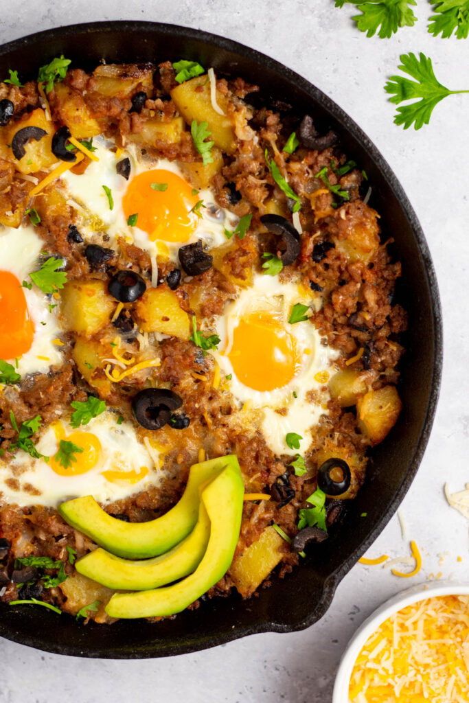This breakfast burrito skillet is a healthy, gluten-free option for a healthy breakfast that's made in only one pan. It's made from only a few easy, real food ingredients, and can be made dairy-free. The ground breakfast sausage cooks with the onions and potatoes, and salsa, black beans and eggs are added to create a filling, flavorful breakfast meal that everyone will enjoy. #onepan #breakfastskillet #glutenfreebreakfast #breakfastburrito #skilletrecipes