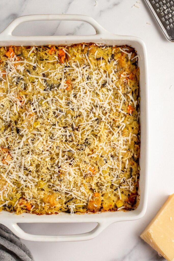This chicken and wild rice casserole recipe is a hearty, easy recipe for a weeknight dinner or to use up leftover chicken or even leftover turkey! The chicken casserole uses fresh onions, carrots and celery and a blend of wild rice mix baked together with perfectly seasoned cream of chicken soup to create a simple meal that is family friendly and meal prep friendly. #chickencasserole #chickenwildrice #wildricerecipes #casserolerecipes #weeknight #mealprep