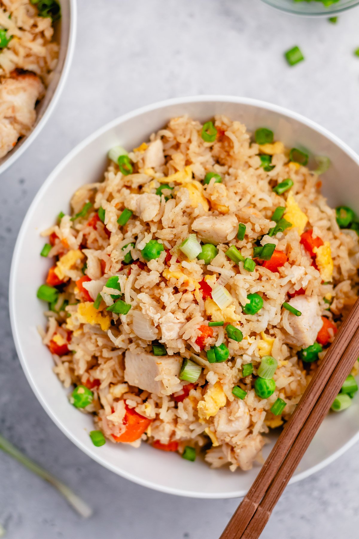 Instant pot chicken fried rice is the perfect one pot recipe for a fast and easy weeknight meal with no mess. It has just a few ingredients and is naturally gluten free and dairy free. You can easily swap out the chicken for extra veggies to make it vegetarian. Look no further for a healthy, satisfying, alternative to take out! #instantpotchicken #onepotmeals #chickenfriedrice