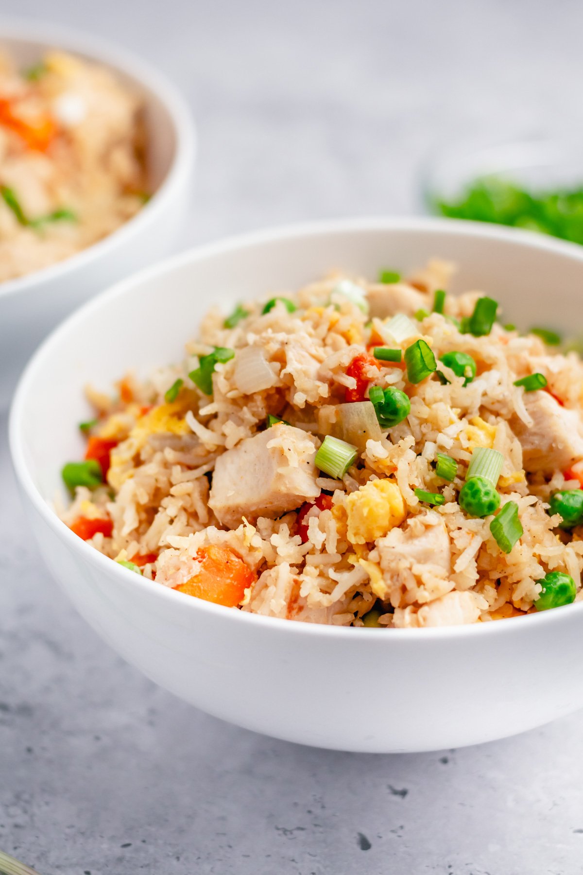 Instant pot chicken fried rice is the perfect one pot recipe for a fast and easy weeknight meal with no mess. It has just a few ingredients and is naturally gluten free and dairy free. You can easily swap out the chicken for extra veggies to make it vegetarian. Look no further for a healthy, satisfying, alternative to take out! #instantpotchicken #onepotmeals #chickenfriedrice