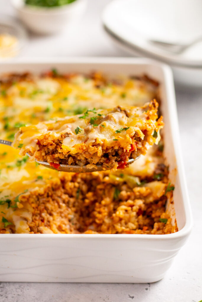 Stuffed peppers make a great meal. This stuffed pepper casserole makes them even better by taking the prep time down to only 15 minutes! It's easy to make, it's gluten free, and it makes enough to feed the whole family. Take the work out of dinner and give this beef stuffed pepper casserole a go for a simple, healthy, and hearty dinner. You won't regret it! #beefcasserole #glutenfree #stuffedpeppers