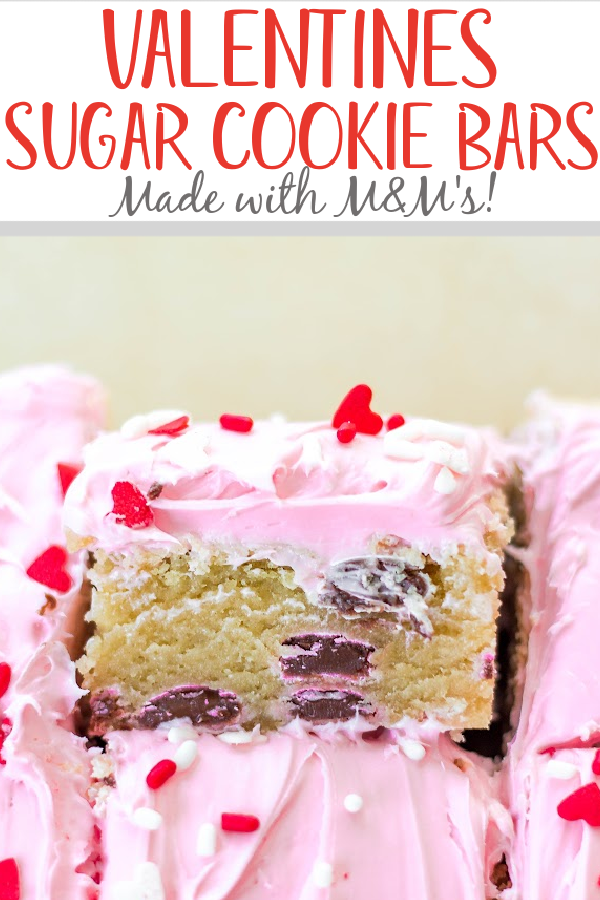 This recipe for M&Ms Valentine's sugar cookie bars are so easy to make and require very few ingredients. This is the only soft and chewy sugar cookie bar recipe you'll ever need, all made in one bowl, and the M&Ms and pink frosting make it fun and festive for a holiday treat! #valentinesdesserts #valentinesbaking #sugarcookies #cookiebars