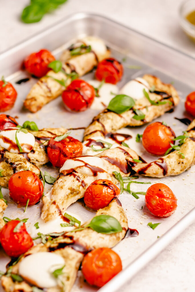 Chicken Caprese Sheet Pan is a super quick and spectacular one-pan meal that’s ready in 30 minutes. This simple dish looks and tastes amazing but it is actually very easy to make and only requires a few ingredients. #healthyrecipes #glutenfreerecipes #healthydinners #fastrecipes