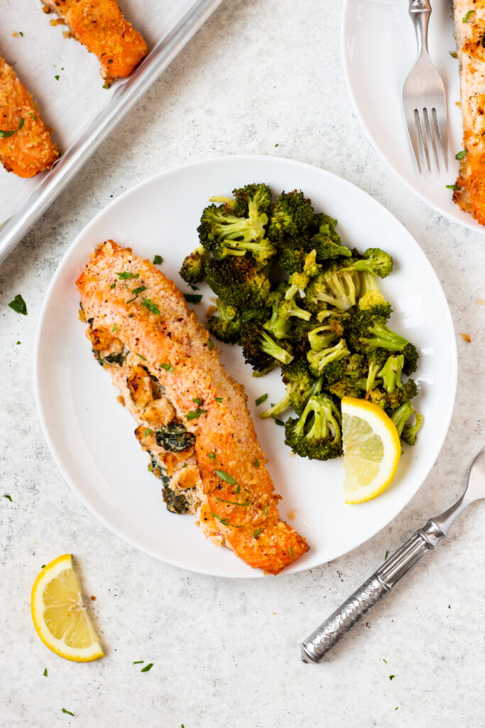 Shrimp stuffed salmon gets you the best of both worlds, the shrimp AND the salmon. This simple recipe takes 30 mins to make from start to finish and can easily be made gluten free. It uses only a few simple ingredients and is the perfect choice for both meal prep and for a family dinner. #glutenfreerecipes #healthydinnerrecipes #stuffedsalmon #shrimp #quickdinnerrecipes #shrimpstuffedsalmon