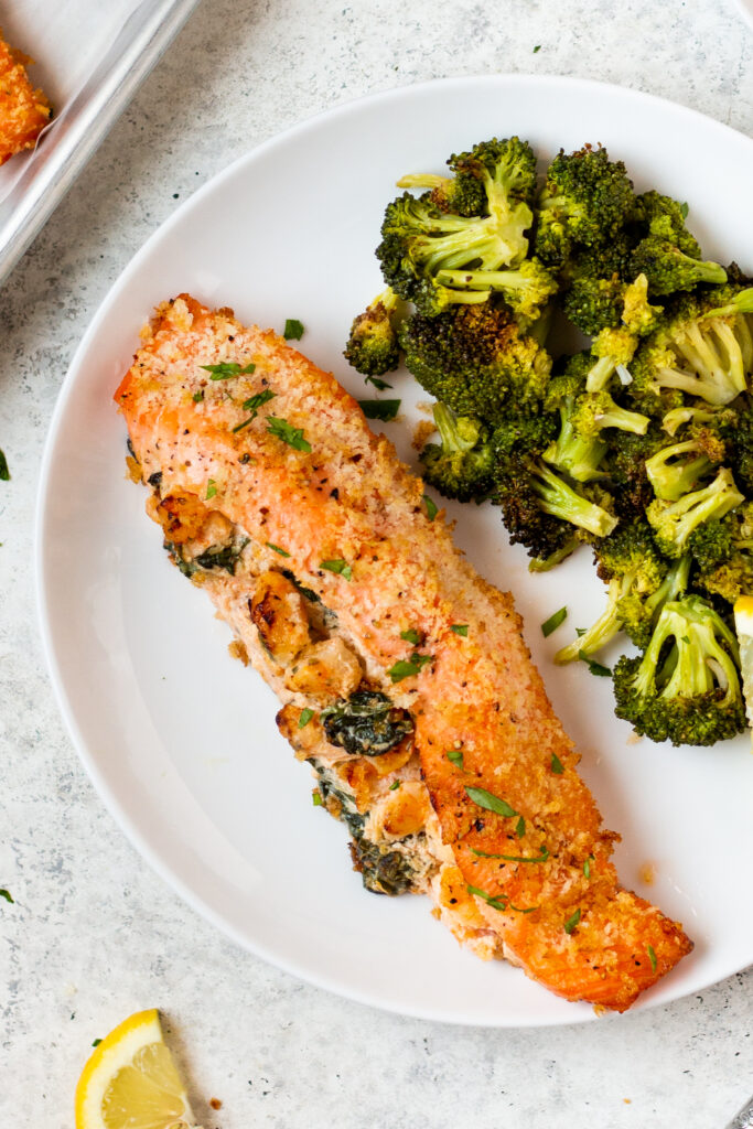 Shrimp stuffed salmon gets you the best of both worlds, the shrimp AND the salmon. This simple recipe takes 30 mins to make from start to finish and can easily be made gluten free. It uses only a few simple ingredients and is the perfect choice for both meal prep and for a family dinner. #glutenfreerecipes #healthydinnerrecipes #stuffedsalmon #shrimp #quickdinnerrecipes #shrimpstuffedsalmon