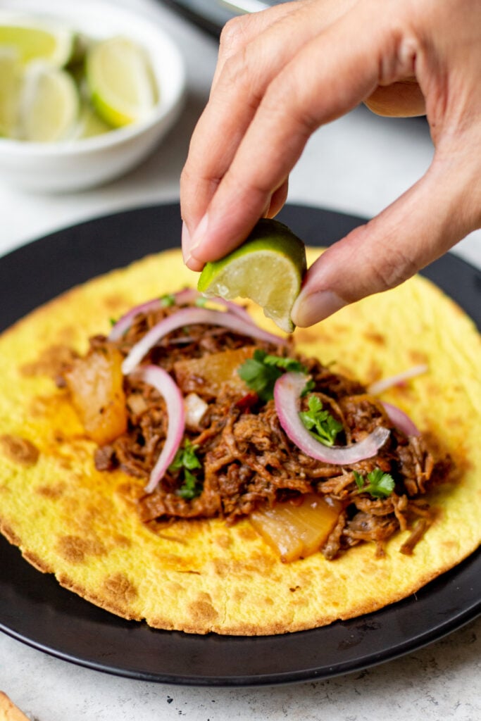 Slow cooker pineapple barbacoa is a super easy recipe to make for a gathering or a family meal and have extra on hand for meal prep or to freeze. This recipe is both gluten free and dairy free and since barbacoa goes perfectly with so many things the possibilities are endless. #barbacoa #beefrecipes #crockpotrecipes #glutenfreerecipes #dairyfreerecipes #glutenfreedairyfreerecipes