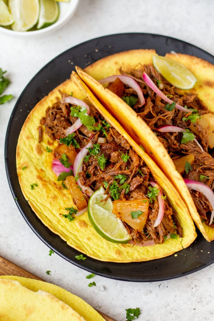 Slow cooker pineapple barbacoa is a super easy recipe to make for a gathering or a family meal and have extra on hand for meal prep or to freeze. This recipe is both gluten free and dairy free and since barbacoa goes perfectly with so many things the possibilities are endless. #barbacoa #beefrecipes #crockpotrecipes #glutenfreerecipes #dairyfreerecipes #glutenfreedairyfreerecipes
