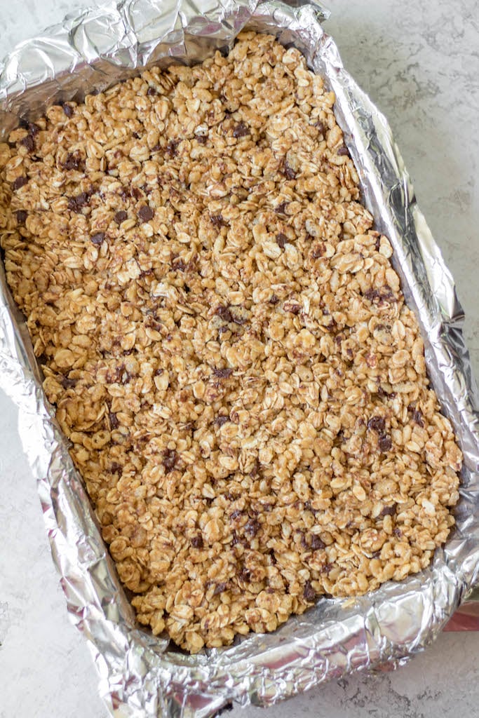 No bake granola bars are super easy to make and use only a few ingredients. They are naturally dairy free and can be made gluten free with zero effort. This recipe is extremely easy to customize to your own tastes and preferences, making microwave granola bars one of the absolute best options for breakfast or simple snack meal prepping! #healthyrecipes #glutenfreerecipes #dairyfreerecipes #glutenfreedairyfreerecipes #healthybreakfast #granolabars #rolledoats